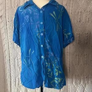 Tropical Tantrum blue button up shirt with green floral design.
